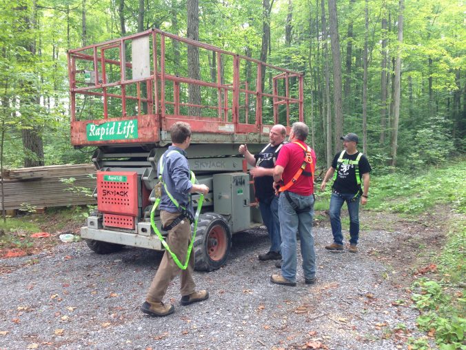 The guys learning how to use a scissor lift